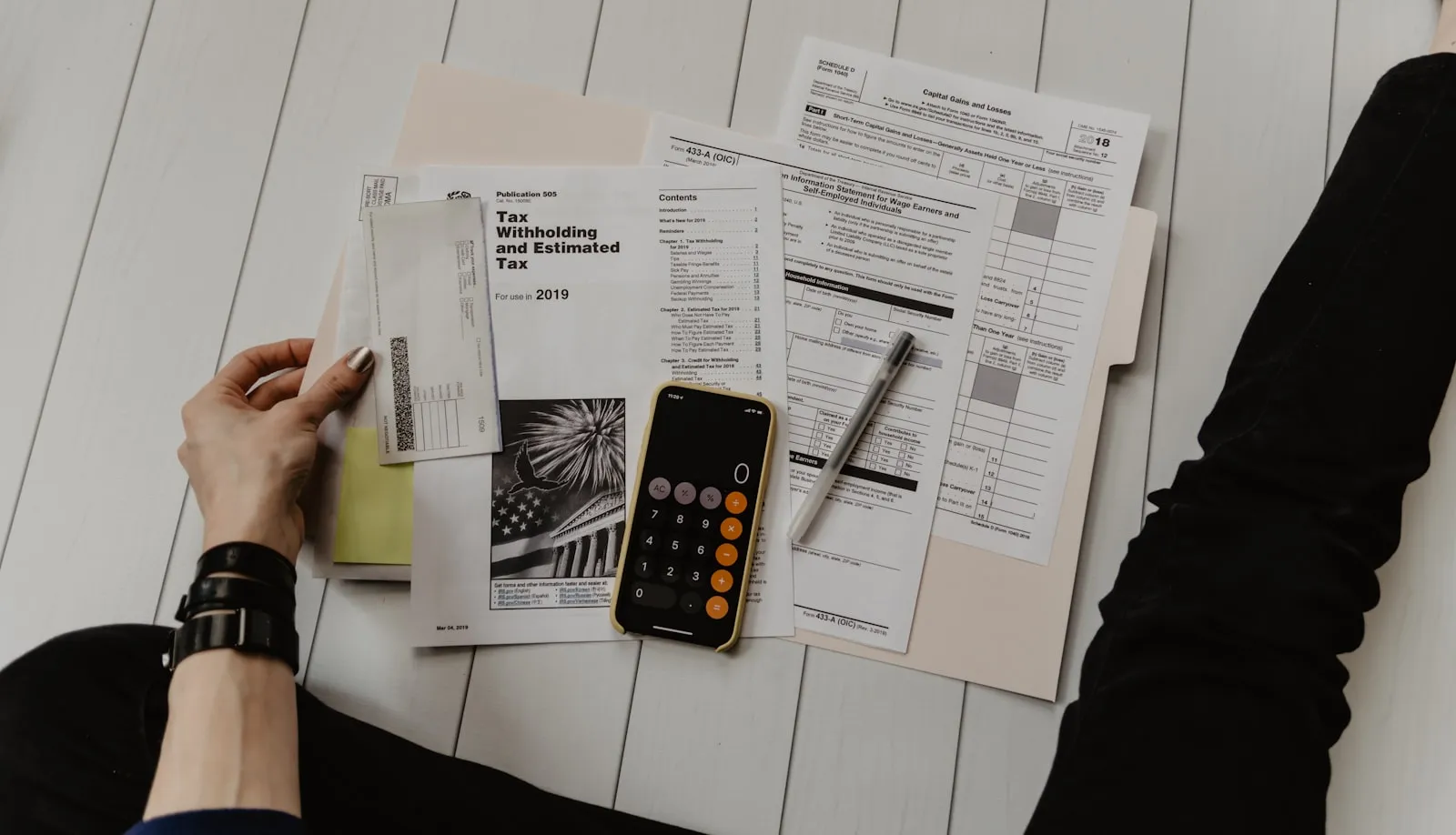 A person reviewing paperwork, representing insurance verification steps